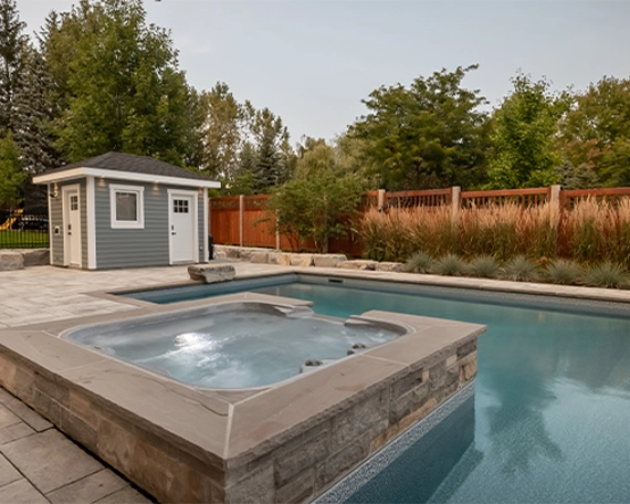 interlocking patio and surface around pool with sodding, wooden deck, fence and carpentry