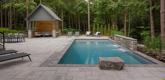 interlocking surface around pool with custom carpentry