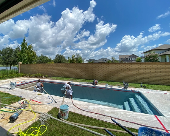 professional team working on pool construction