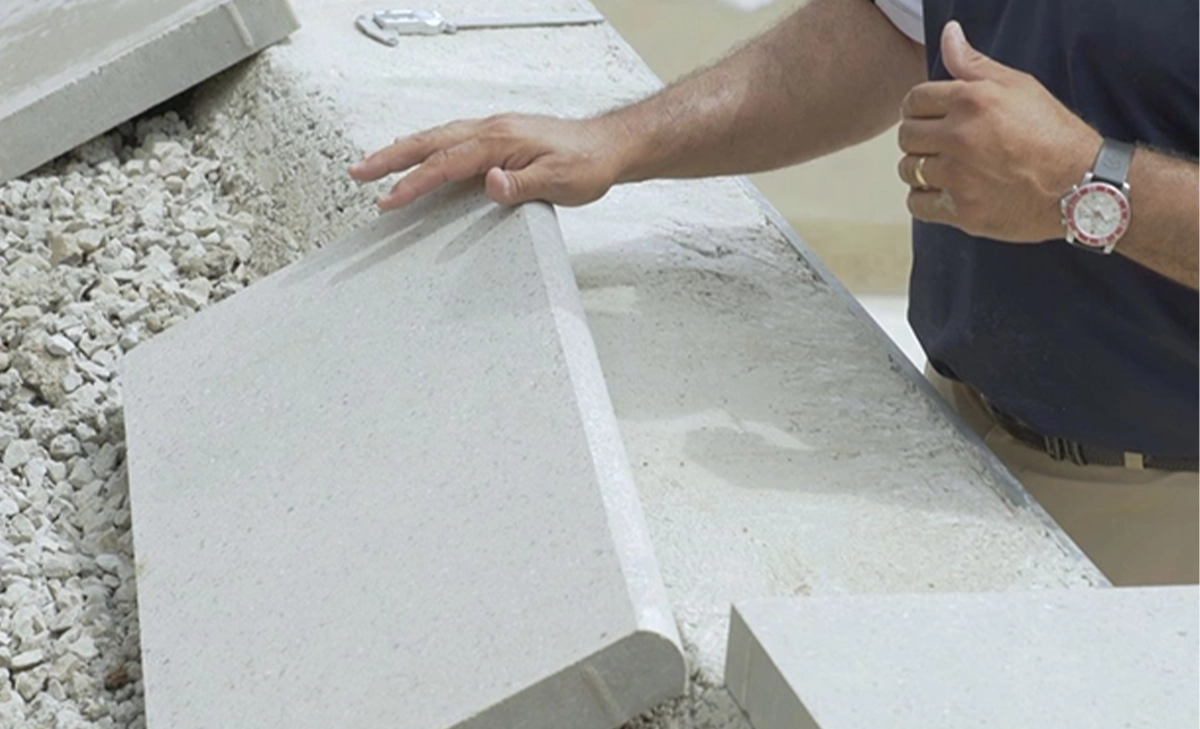 professional man installing pool coping professional man installing pool coping