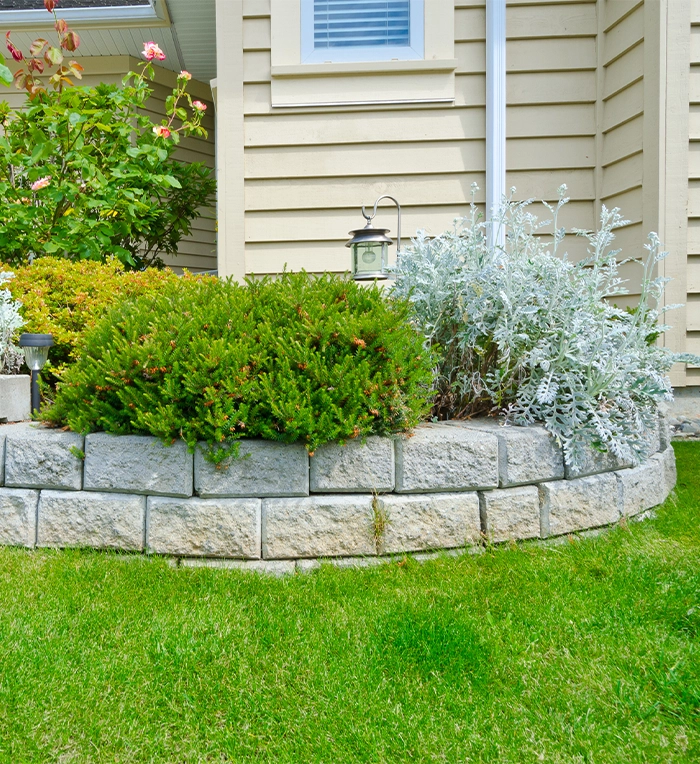 round interlocking retaining wall in home front yard