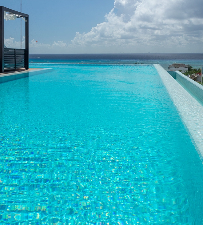 large infinity swimming pool close view near sea side
