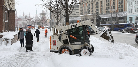 snow removal image twelve snow removal tractor on road side clearing walkway