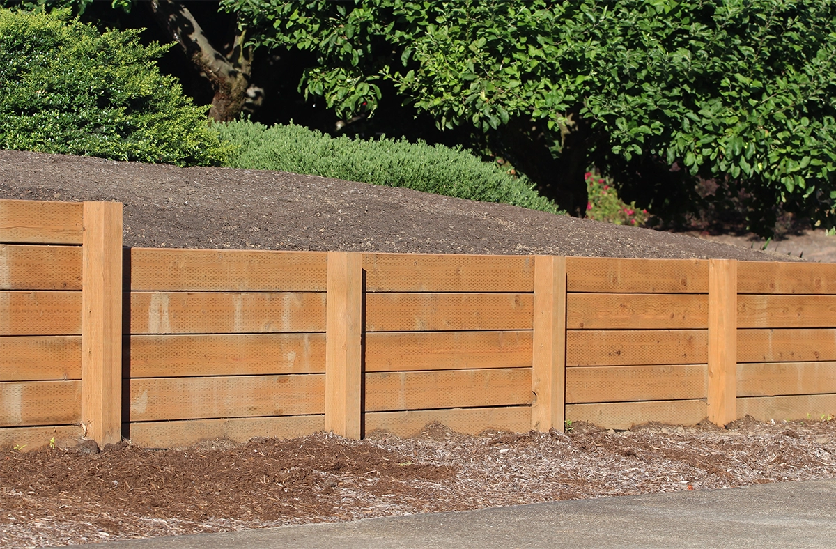 wooden retaining wall holds back soil wooden retaining wall holds back soil