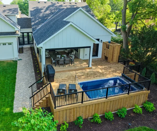 backyard-landscaping-toronto large deck with built in pool in a beautiful backyard