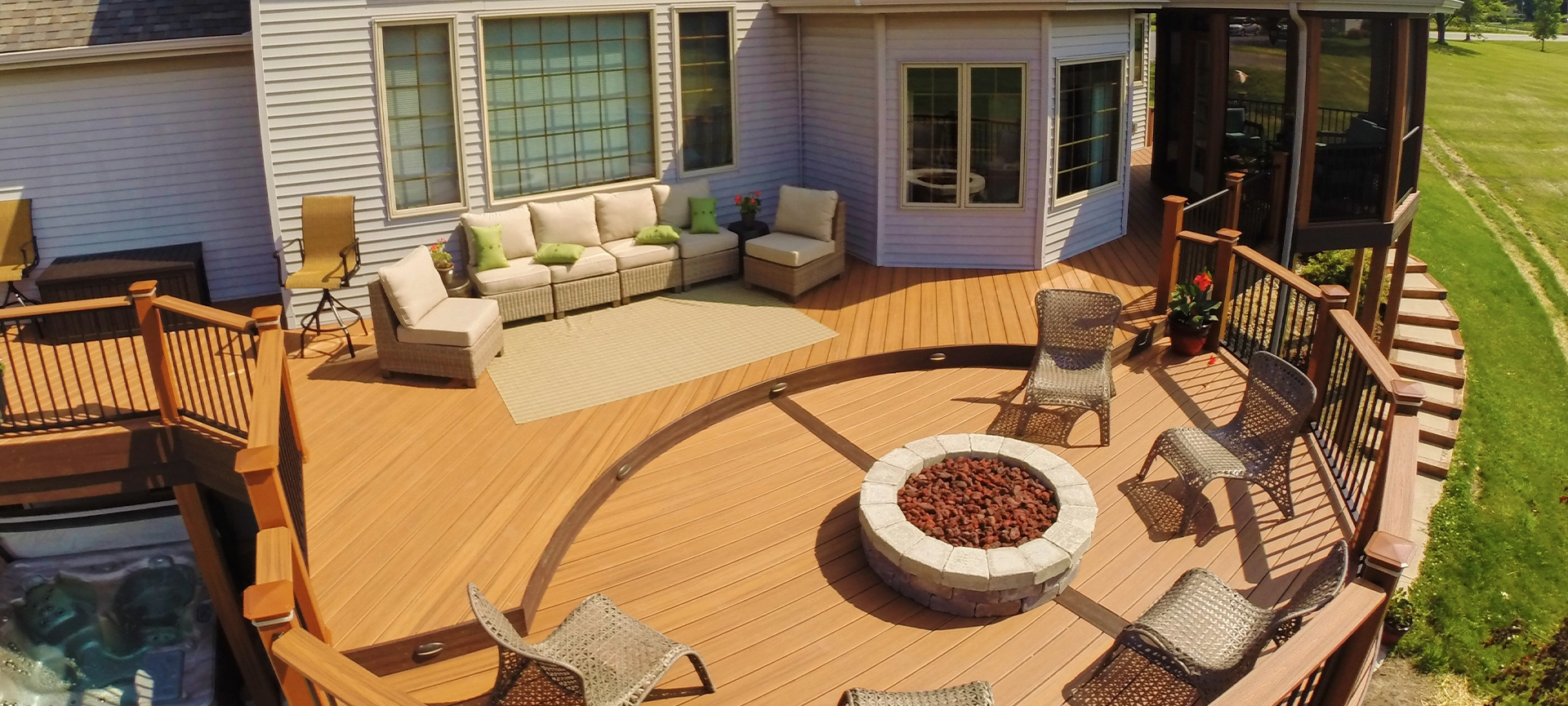 Aerial View of Sunny Suburban Deck with Fire Pit and Gazebo