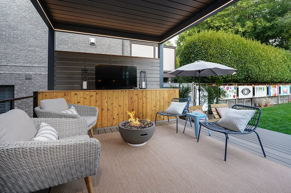 beautiful deck with a firepit and TV