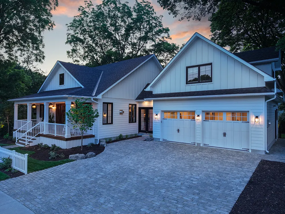 large home with a big interlocked driveway in the evening