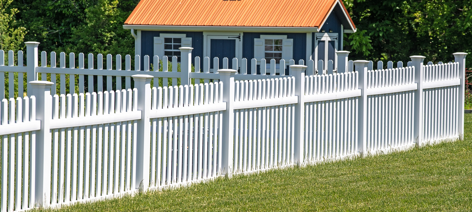 white vinyl fence fencing of private property grass plastic nature clean modern green garden