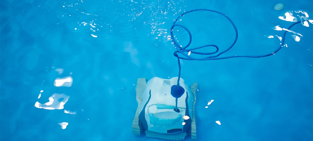 The robot is cleaning the pool. Maintenance pool concept.