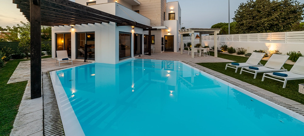 Modern house with garden swimming pool and wooden pergula