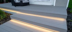 Modern multi-level composite decking in ash grey with subtle deck lights for contempo
