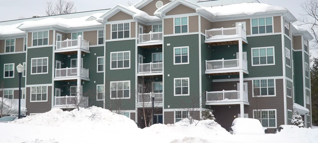 modern apartment building after winter snow storm