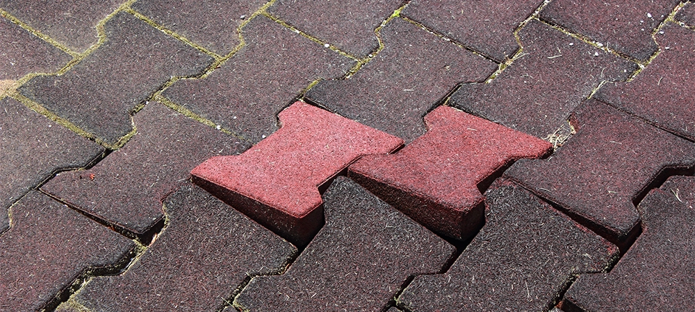 Uneven Interlocking brick floor requiring repair