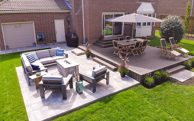 deck and interlock patio in home backyard, seating area