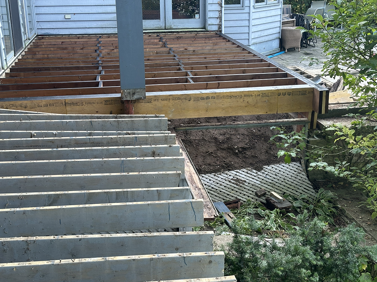 new deck being built in a backyard