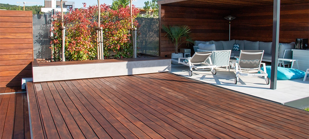 Wooden gazebo and modern home garden design with hardwood floor patio