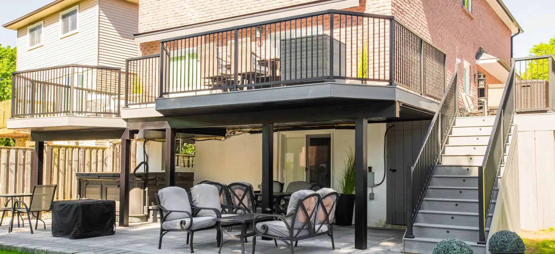 large brand new trex deck in a backyard