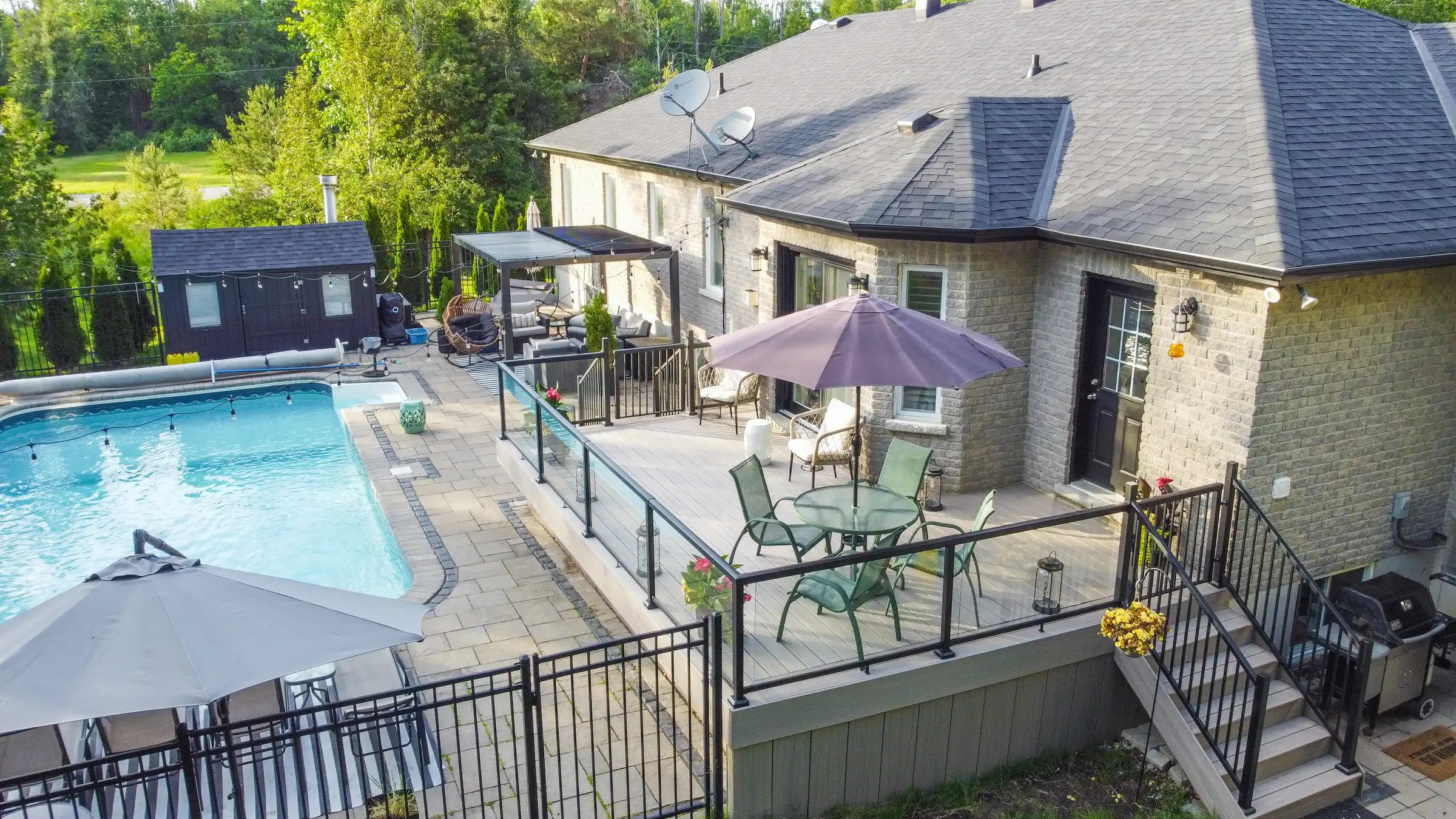 aierial backyard pool and trex deck house exterior