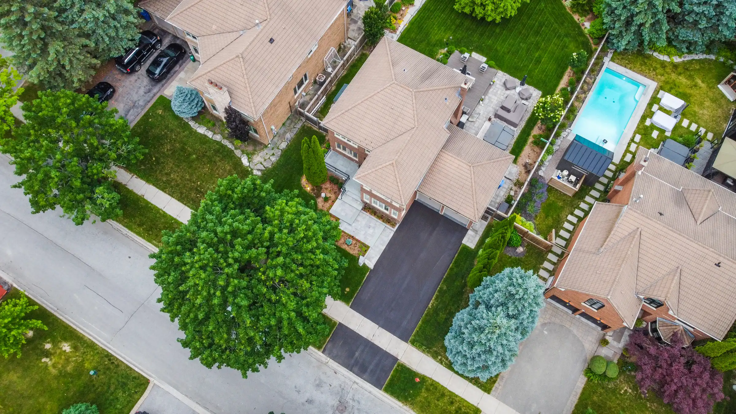 aerial view of a house with a newly paved driveway