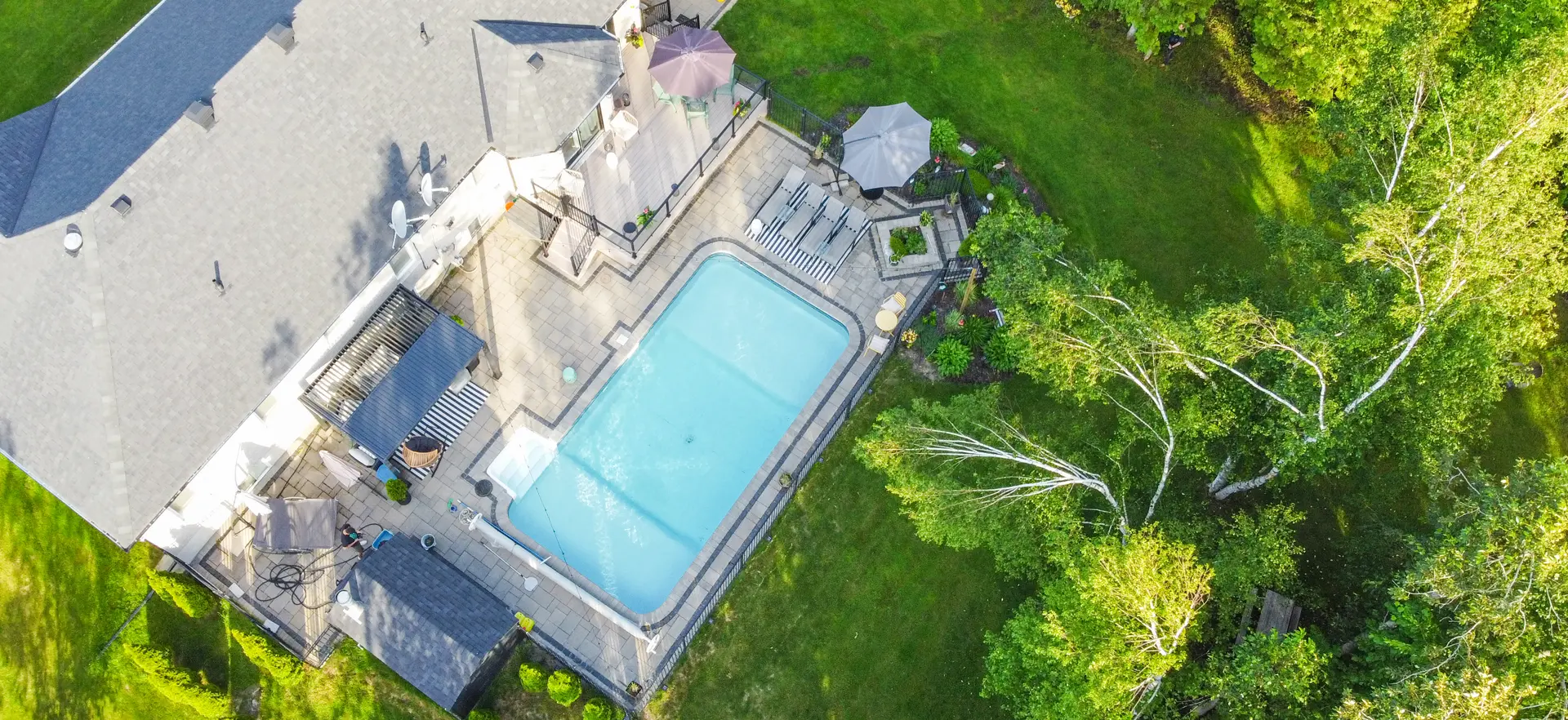 backyard-pool-cover large backyard with a pool and trex deck