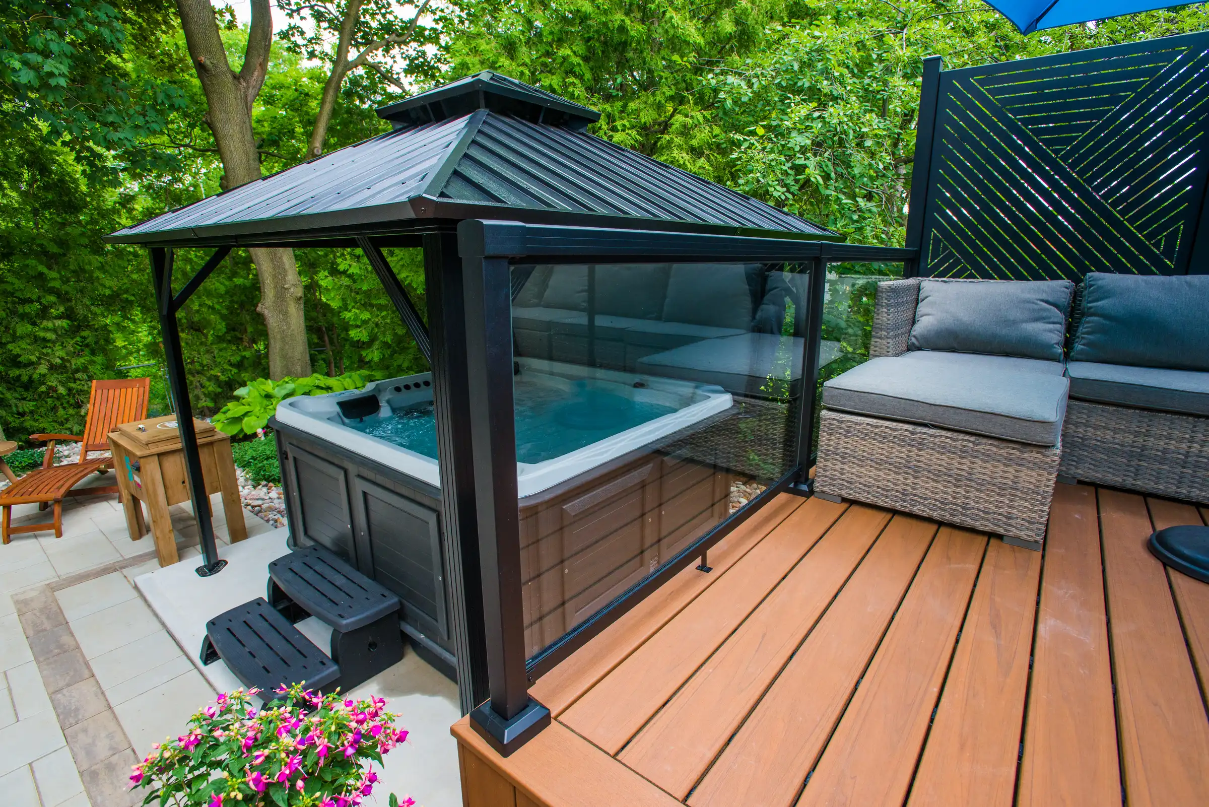 trex deck with a gazebo and a hot tub