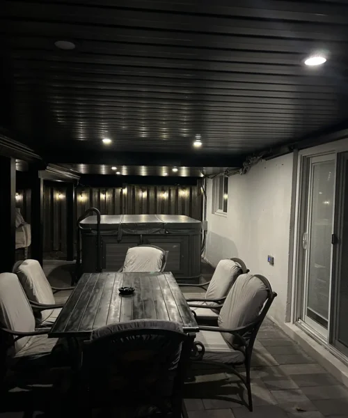 Covered under-deck dining area with lighting
