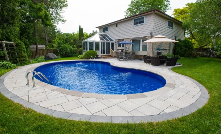 Restored backyard pool with new interlock coping