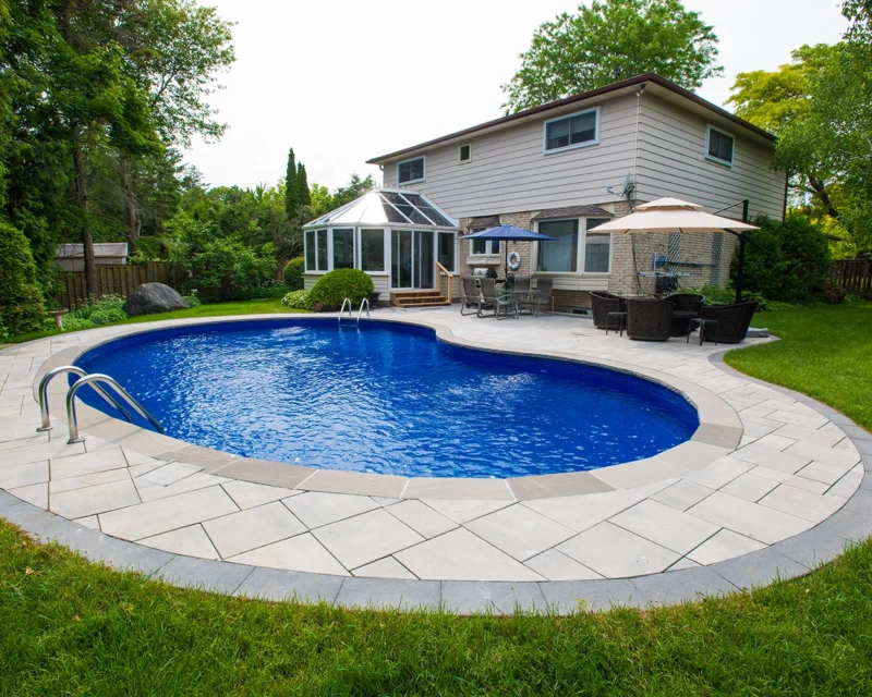 Restored backyard pool with new interlock coping