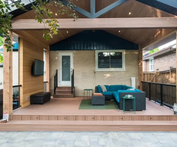 The Pergola Job Horizontal 1 Front view of a custom wooden pergola over a deck