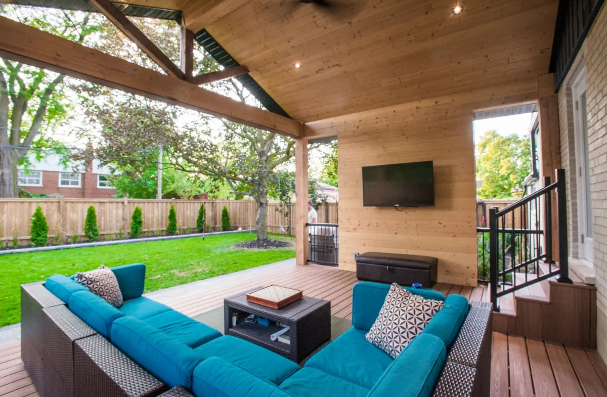 Outdoor sectional under a pergola with cathedral ceiling