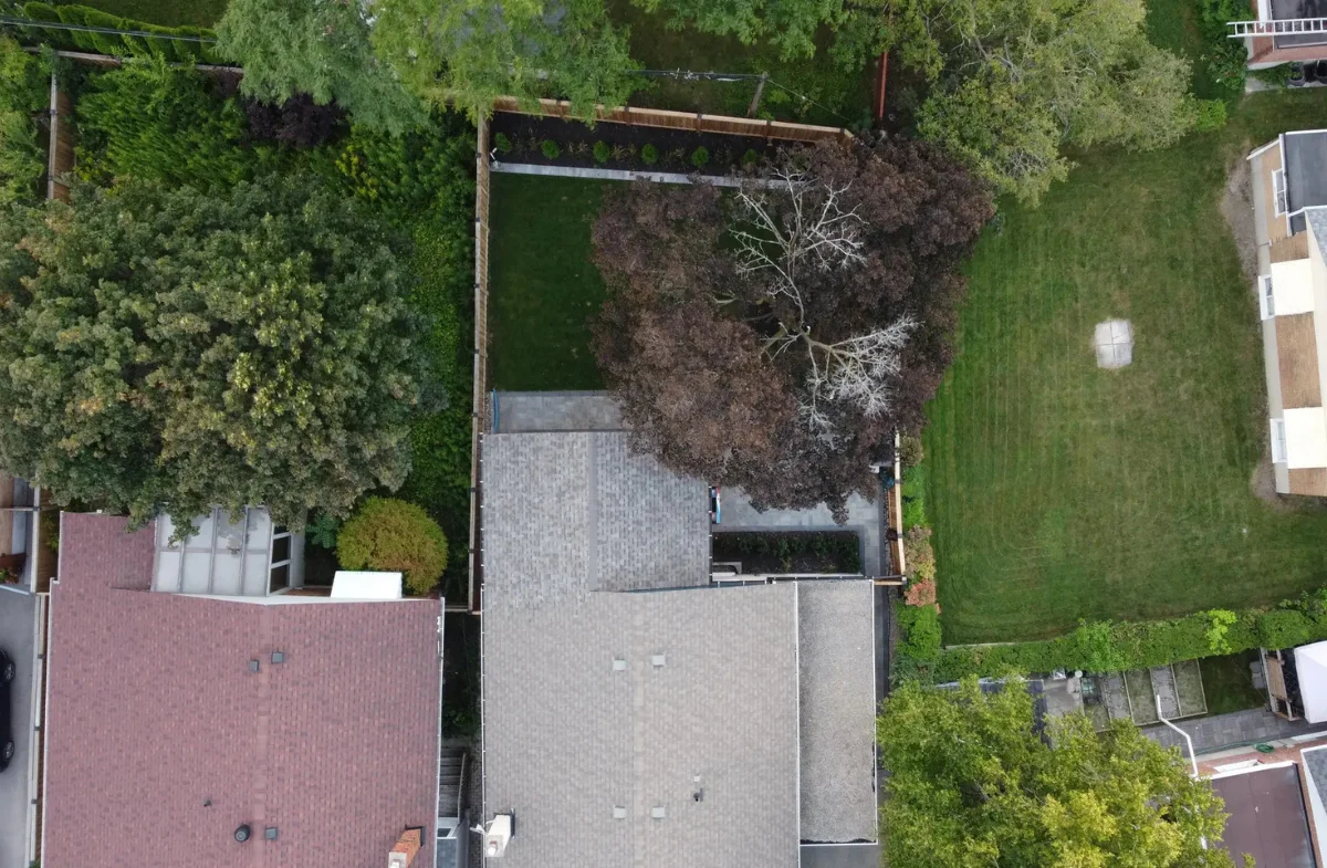 Aerial view of a backyard pergola and deck