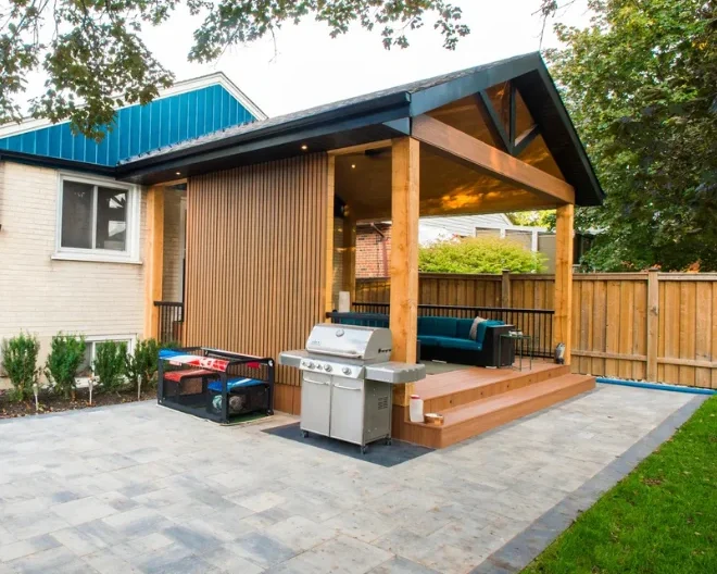 Interlock patio beside a custom pergola