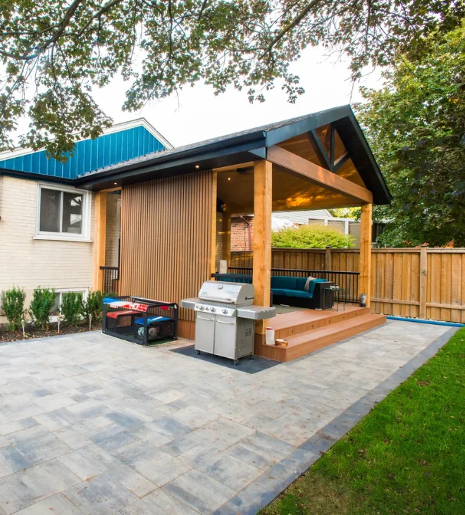 Interlock patio beside a custom pergola