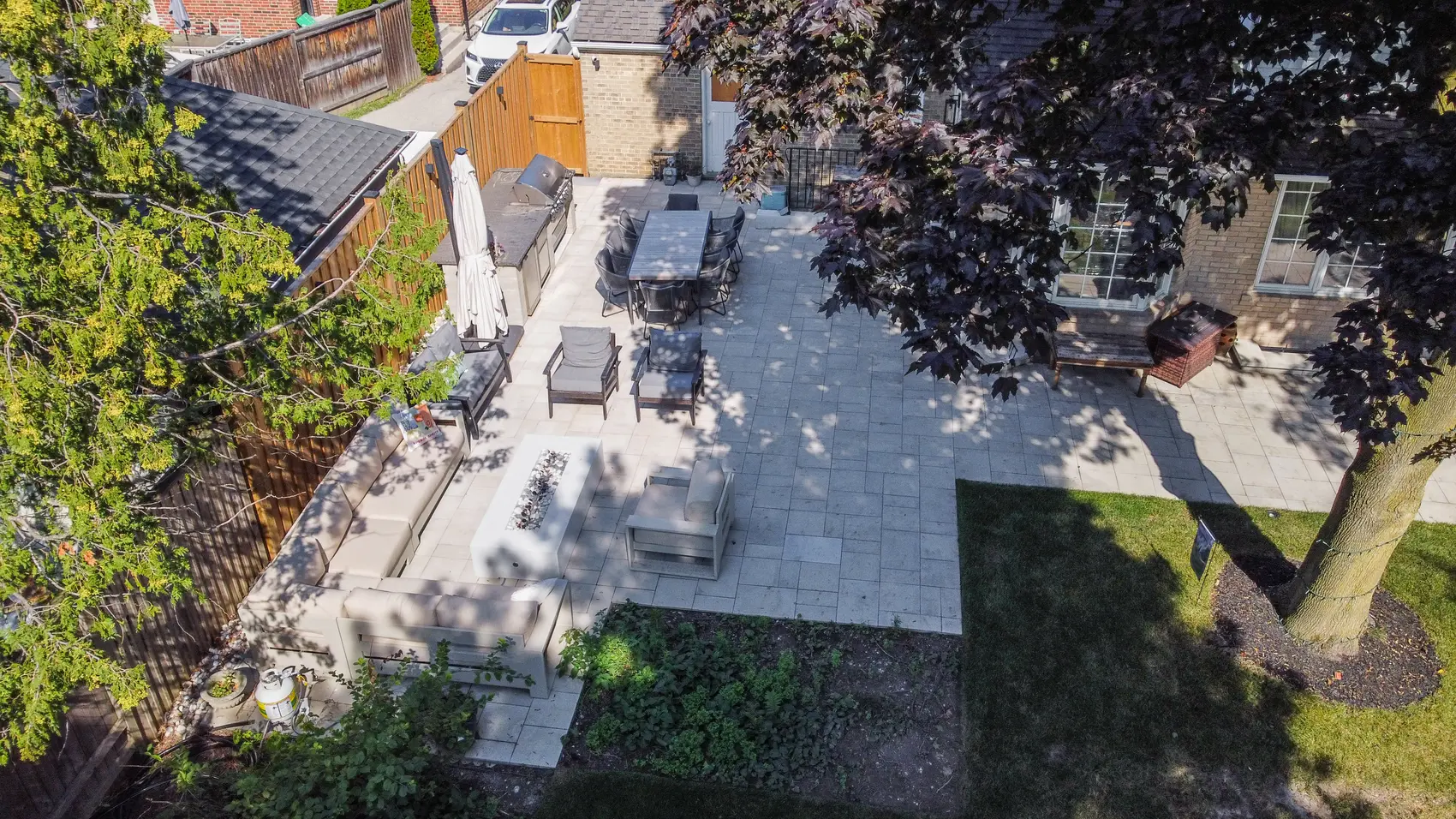 Aerial view of North York interlocking patio with outdoor kitchen and dining area