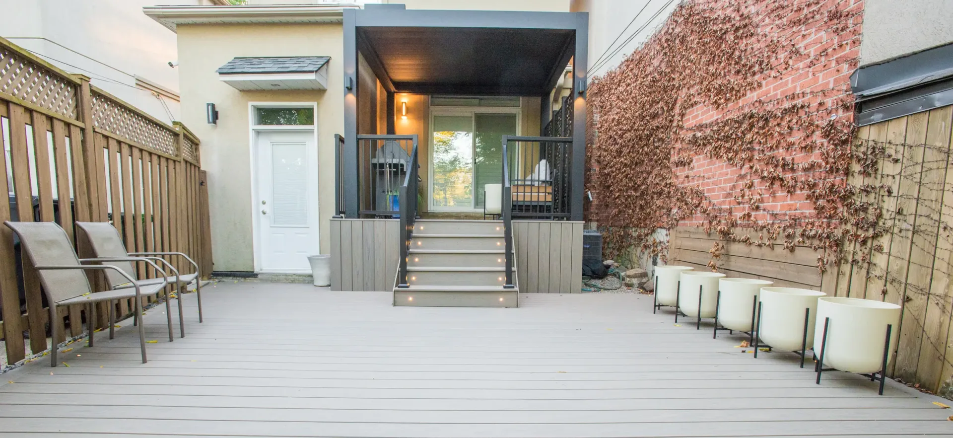 Danforth backyard Trex deck leading to an electric pergola