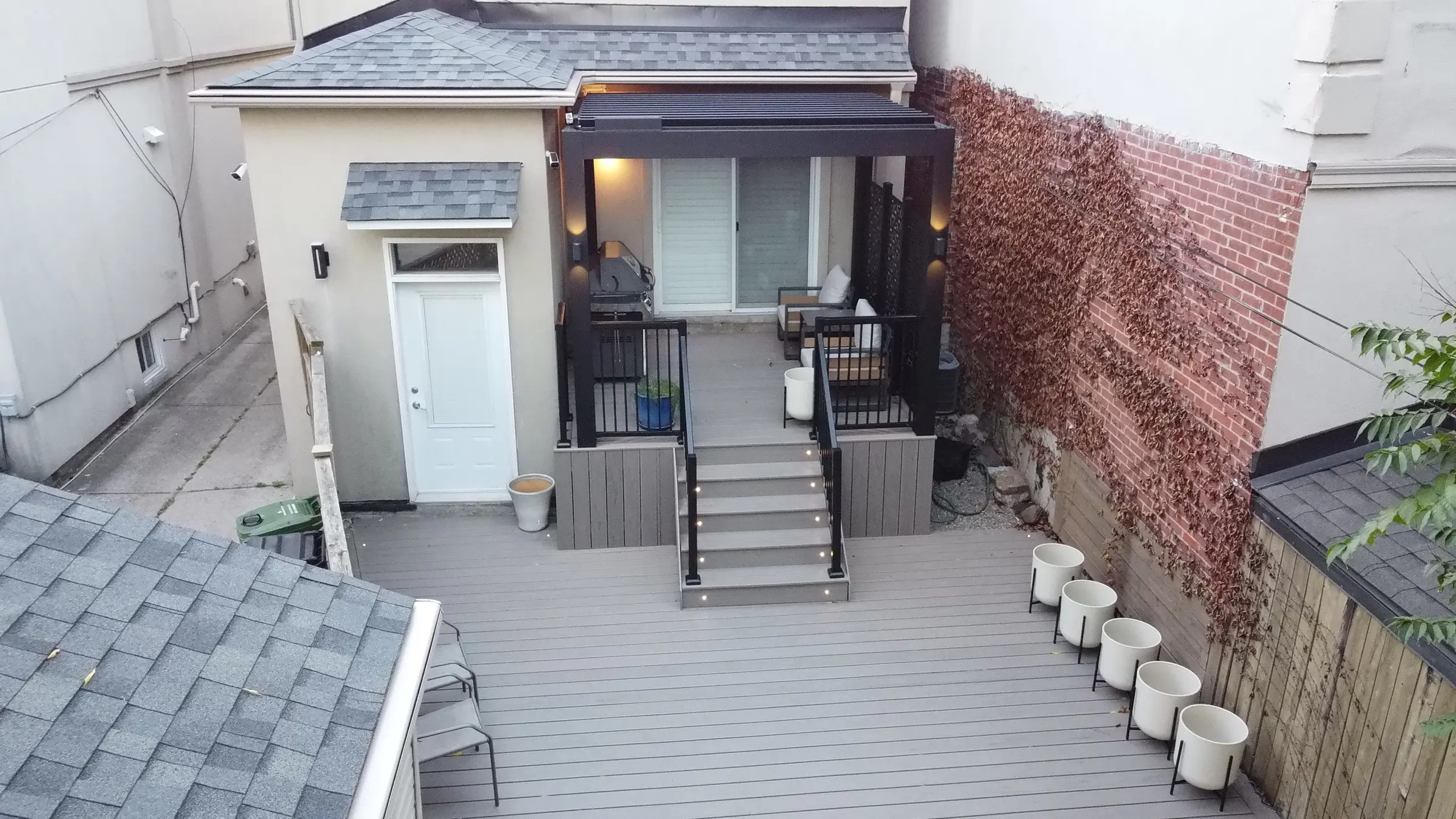 Elevated view of Danforth Trex deck and electric pergola behind the house