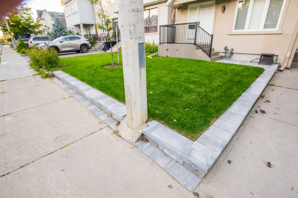 Front yard interlock border along the lawn