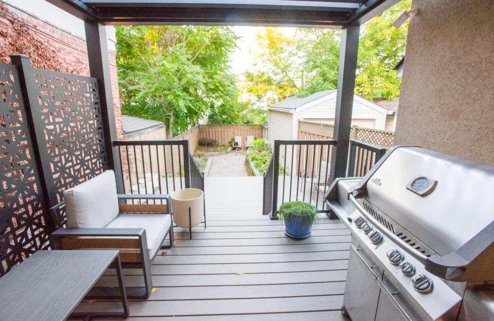 BBQ grill and seating under the electric pergola