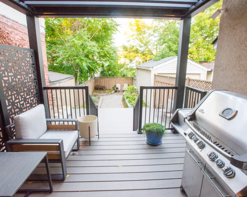 BBQ grill and seating under the electric pergola