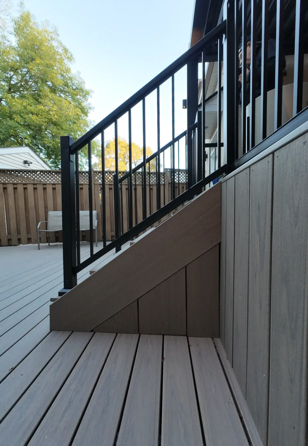 Trex stair skirting with black aluminum railing
